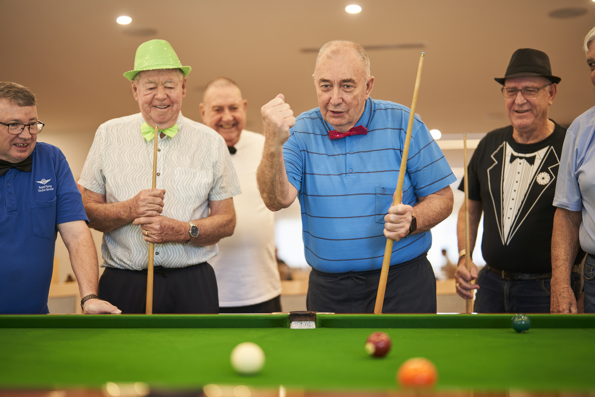 Nelsons Grove residents playing a game of pool on the billiards table