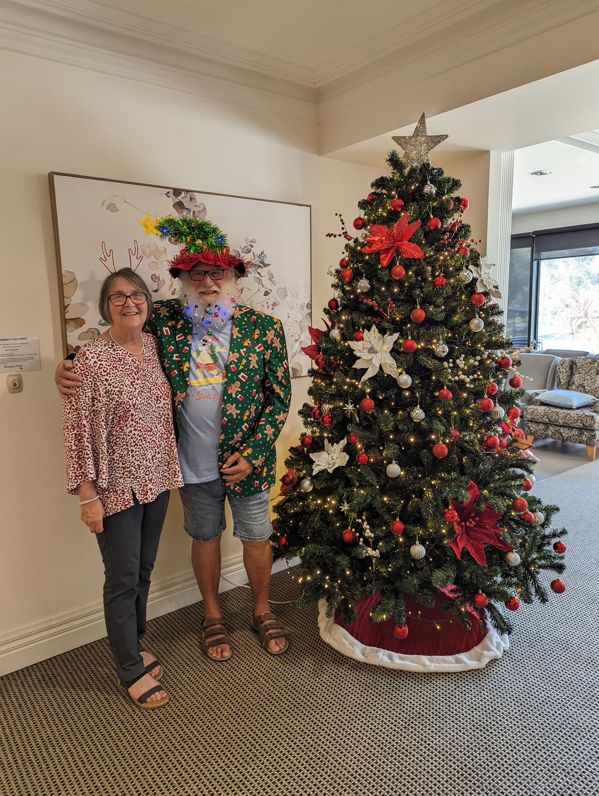 Robert has created a tradition by dressing up as Santa and taking a photo with residents who use it as a Christmas holiday card - 'Grandma with Santa'