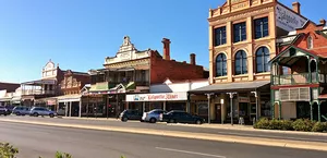 A main street in Kalgoorlie, Western Australia, lined with historic buildings dating back to the early 1900s.