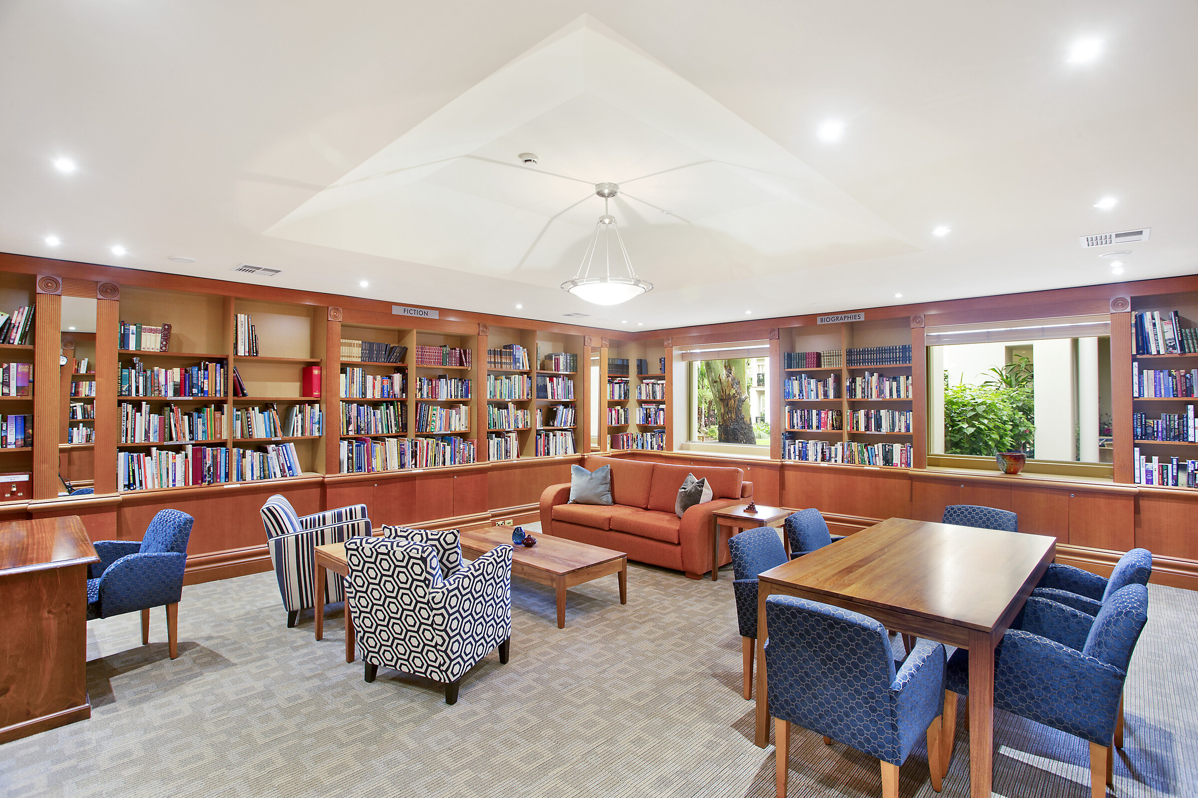 Library room with well stocked bookcases