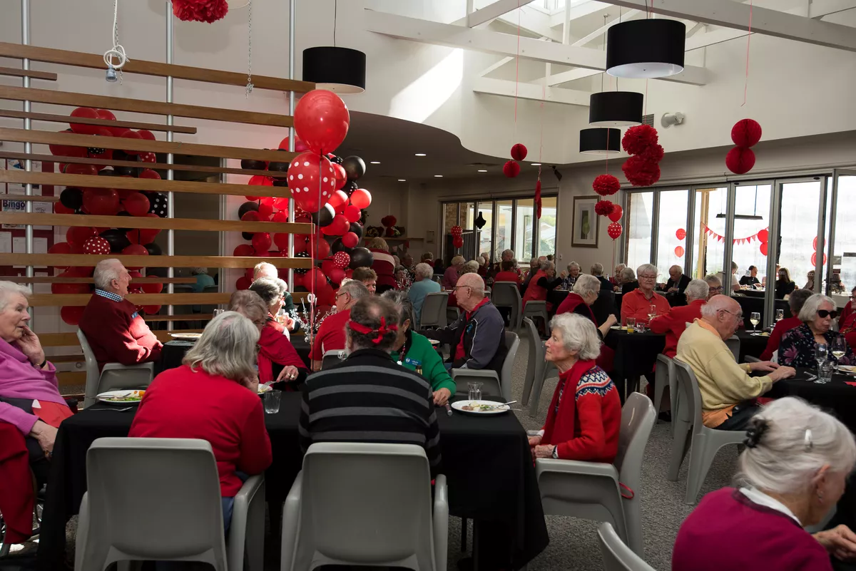 The Abervale retirement village dining room decorated in red for the 40 year anniversary