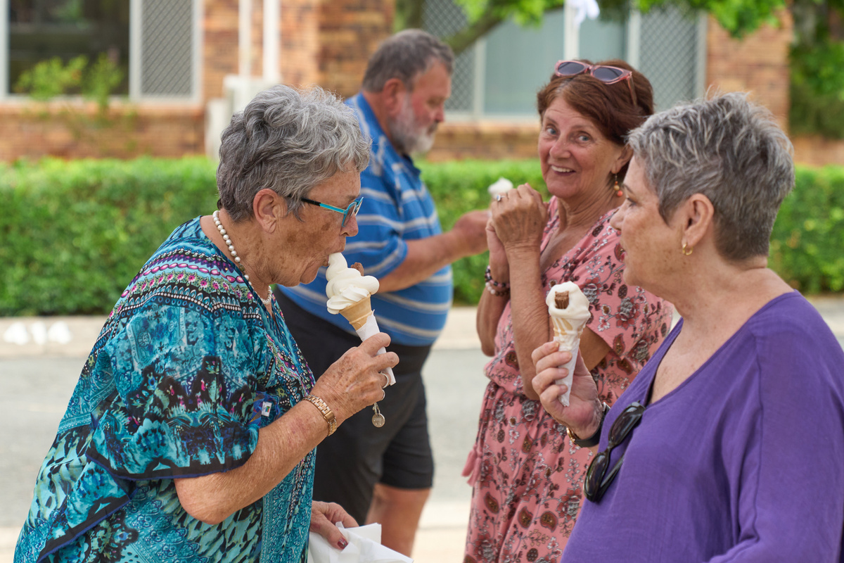 A couple of seniors enjoying an ice cream outside a retirement village