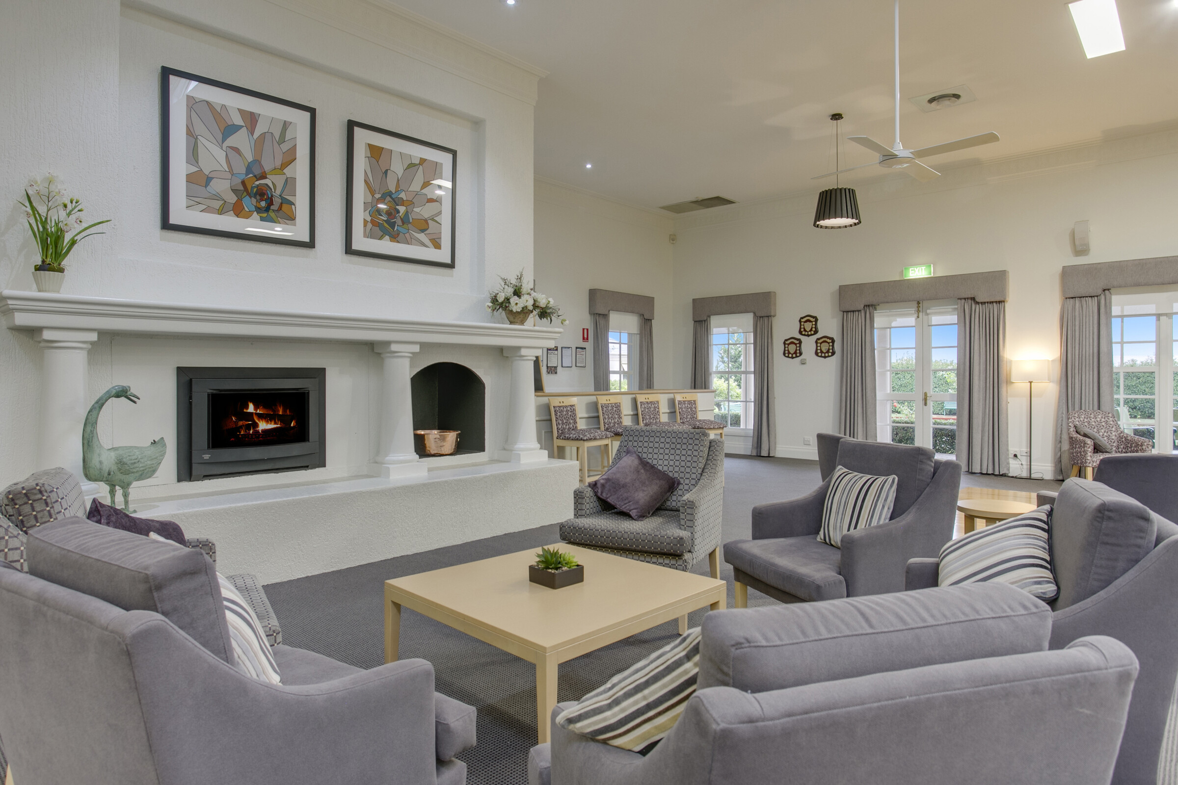 Port Phillip Village lounge area with seating and fireplace