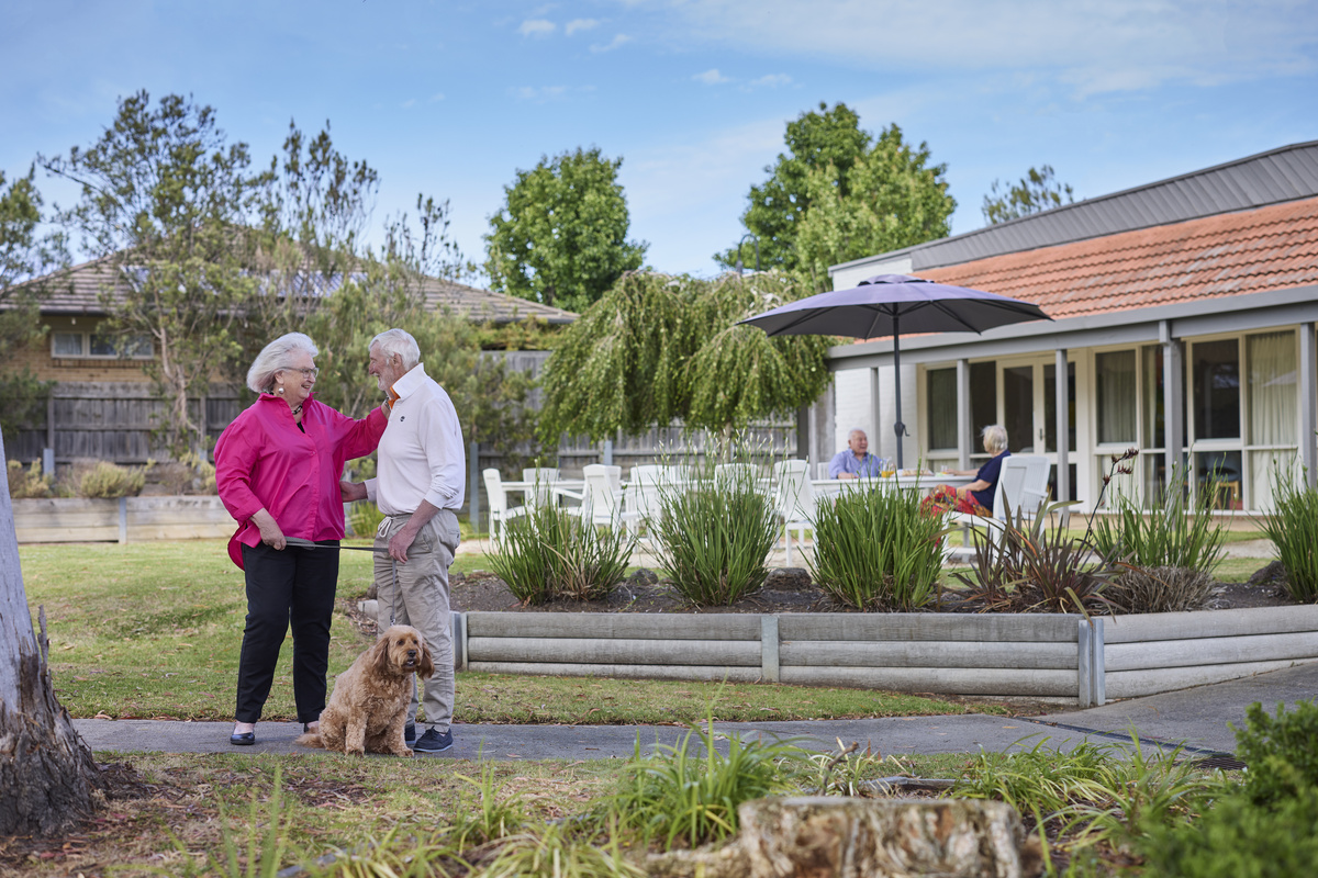 Couple walking through gardens