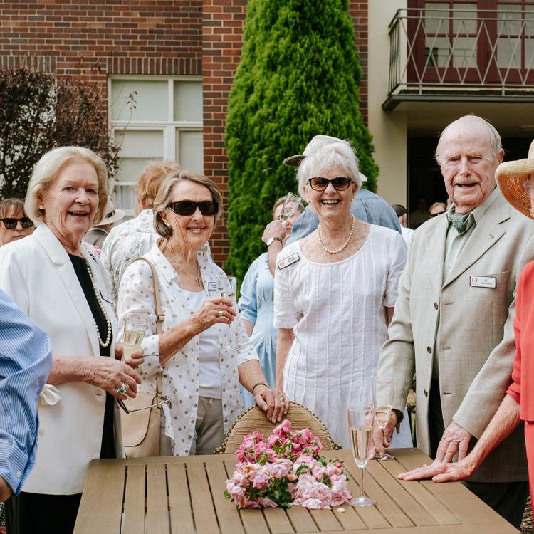 A group of Annesley Bowral residents standing and posing for the camera on the Village of the Year celebrations held at the village in Bowral, NSW
