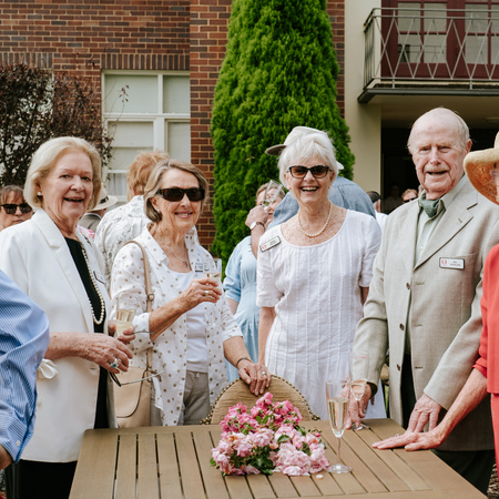 A group of Annesley Bowral residents standing and posing for the camera on the Village of the Year celebrations held at the village in Bowral, NSW