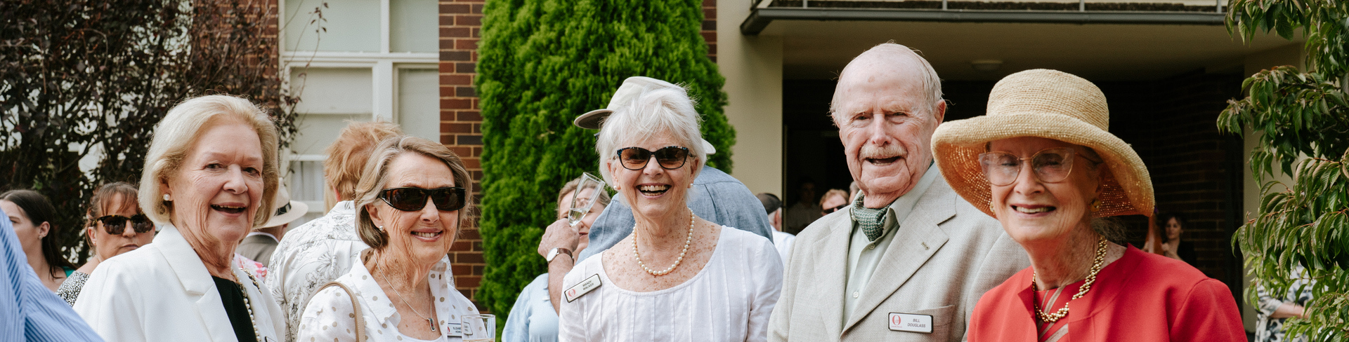 A group of Annesley Bowral residents standing and posing for the camera on the Village of the Year celebrations held at the village in Bowral, NSW