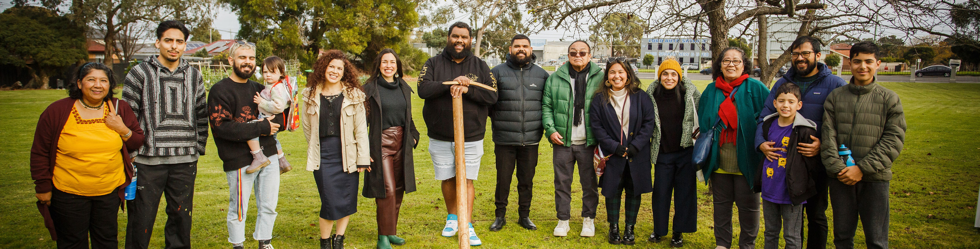 Artists from El Salvador and residents from Lexington Gardens posing for a group photo