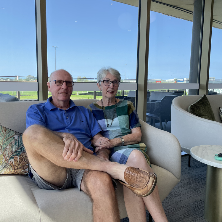 Bernborough Ascot residents Janis and Peter sitting on a couch