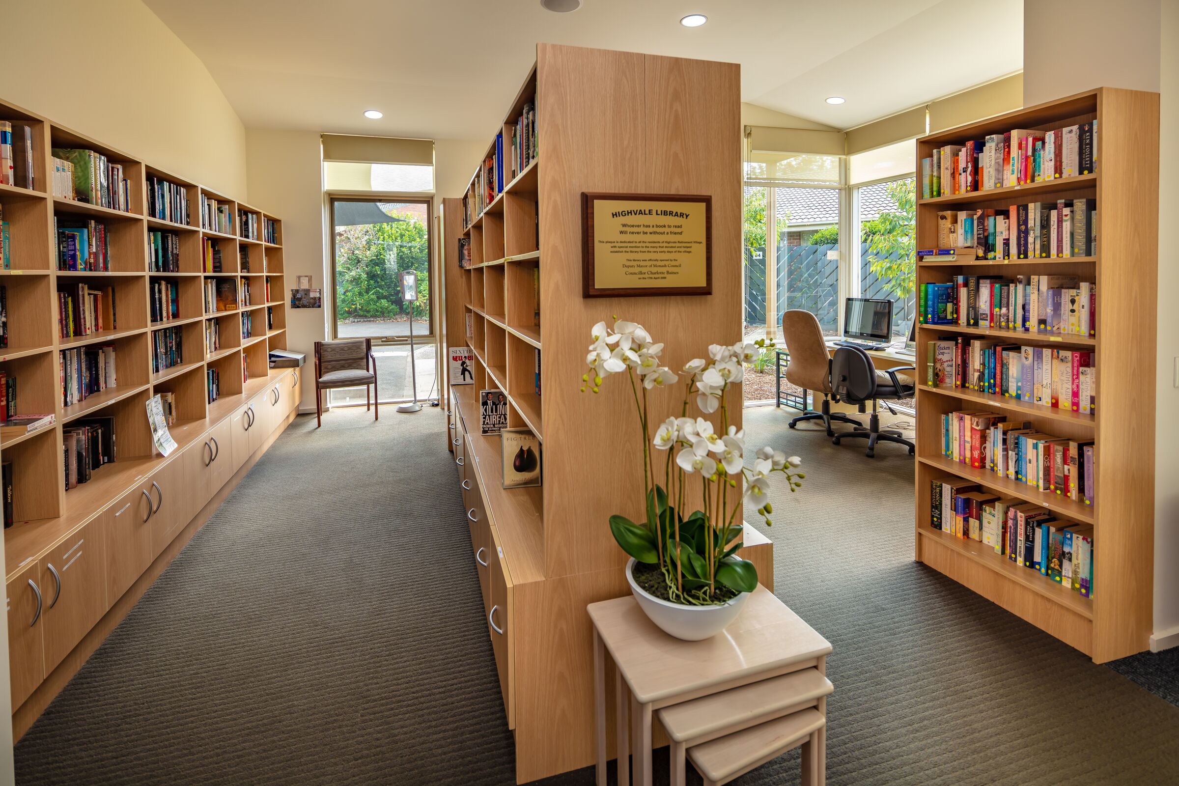 Highvale Village computer and library room with well stocked bookcases