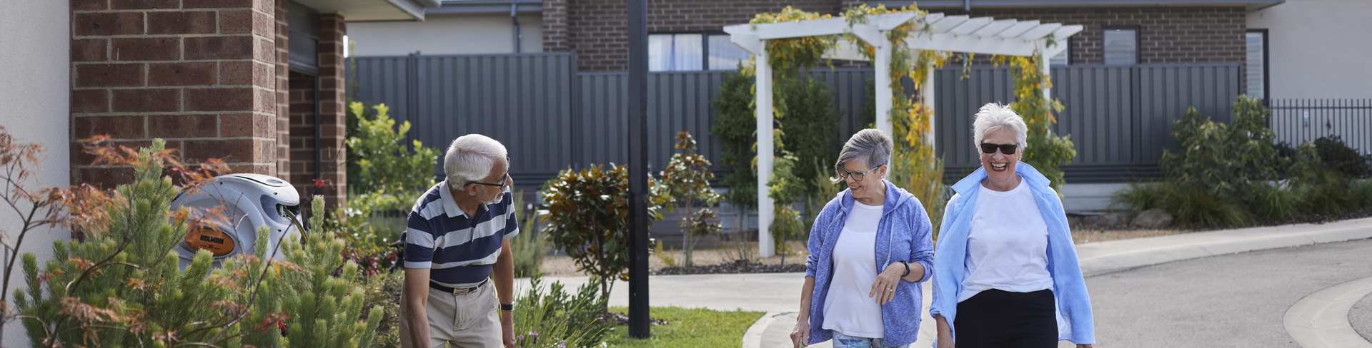 Seniors enjoying a leisurely stroll through the Sherwin Rise village