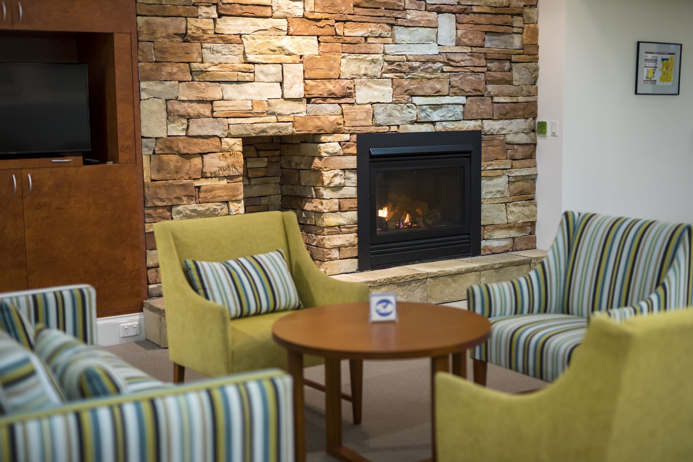 Waterford Valley Lakes indoor fireplace with surrounded by comfortable seating