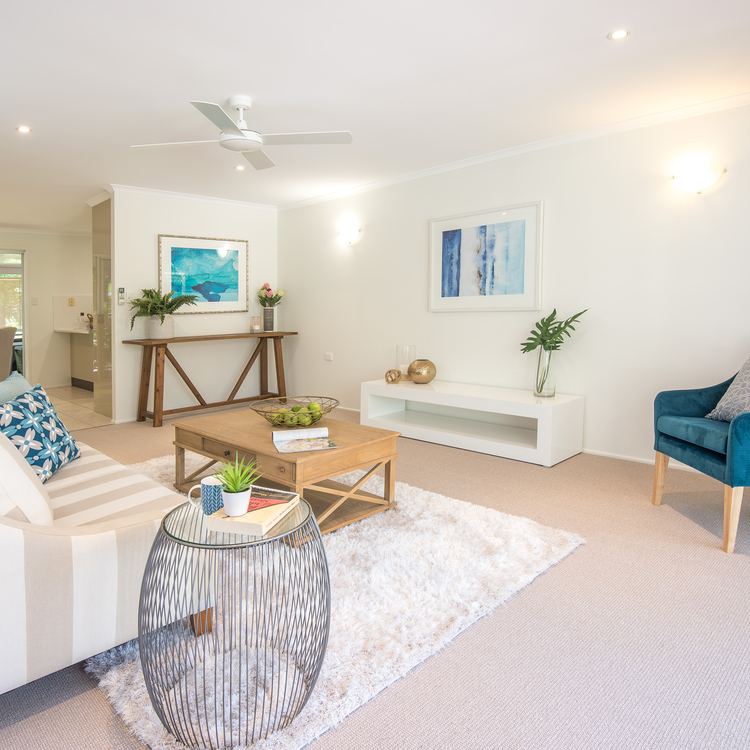 An open space living area in a theme of white and blue