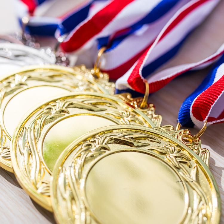 Olympic medals laid on a bench