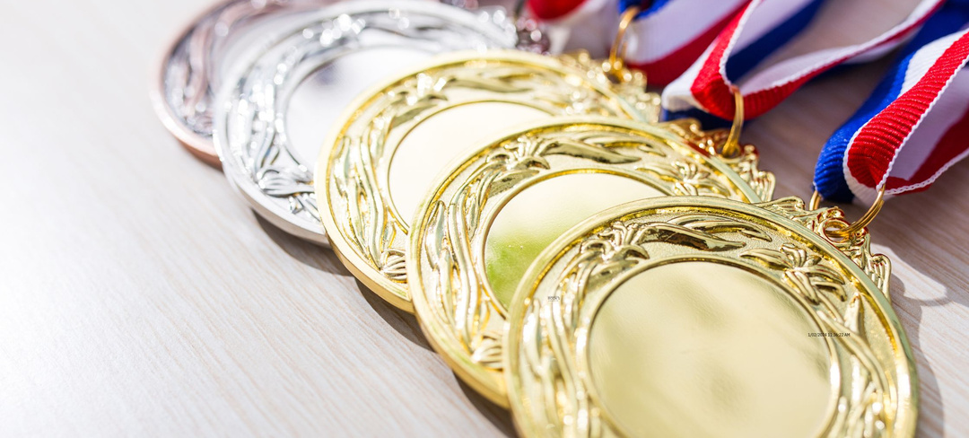 Olympic medals laid on a bench