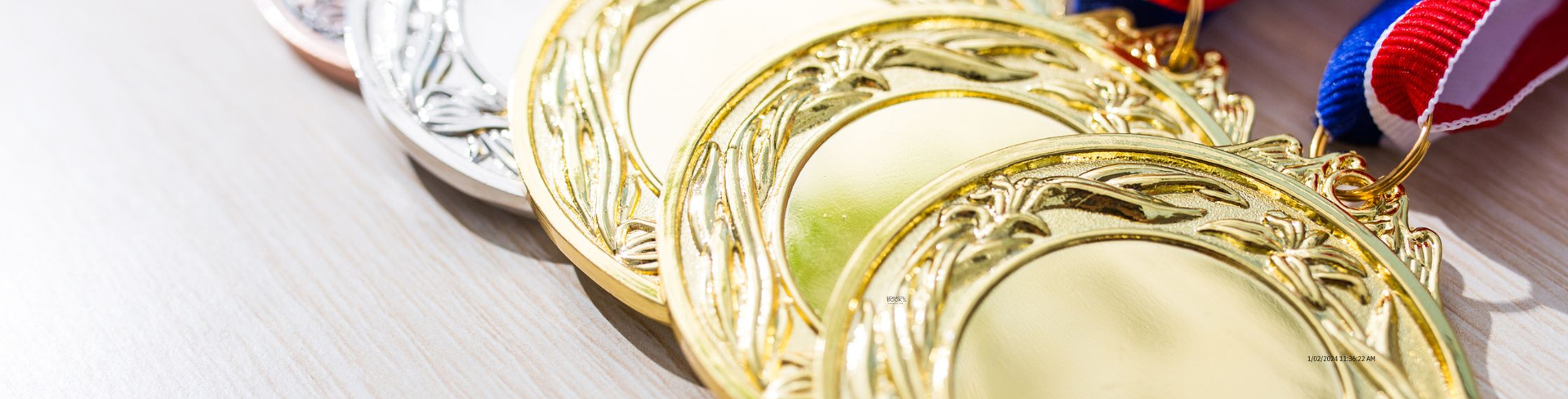 Olympic medals laid on a bench