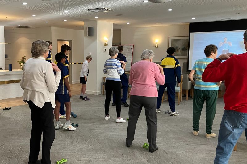 The residents at Menzies Malvern bonding with students of De La Salle College