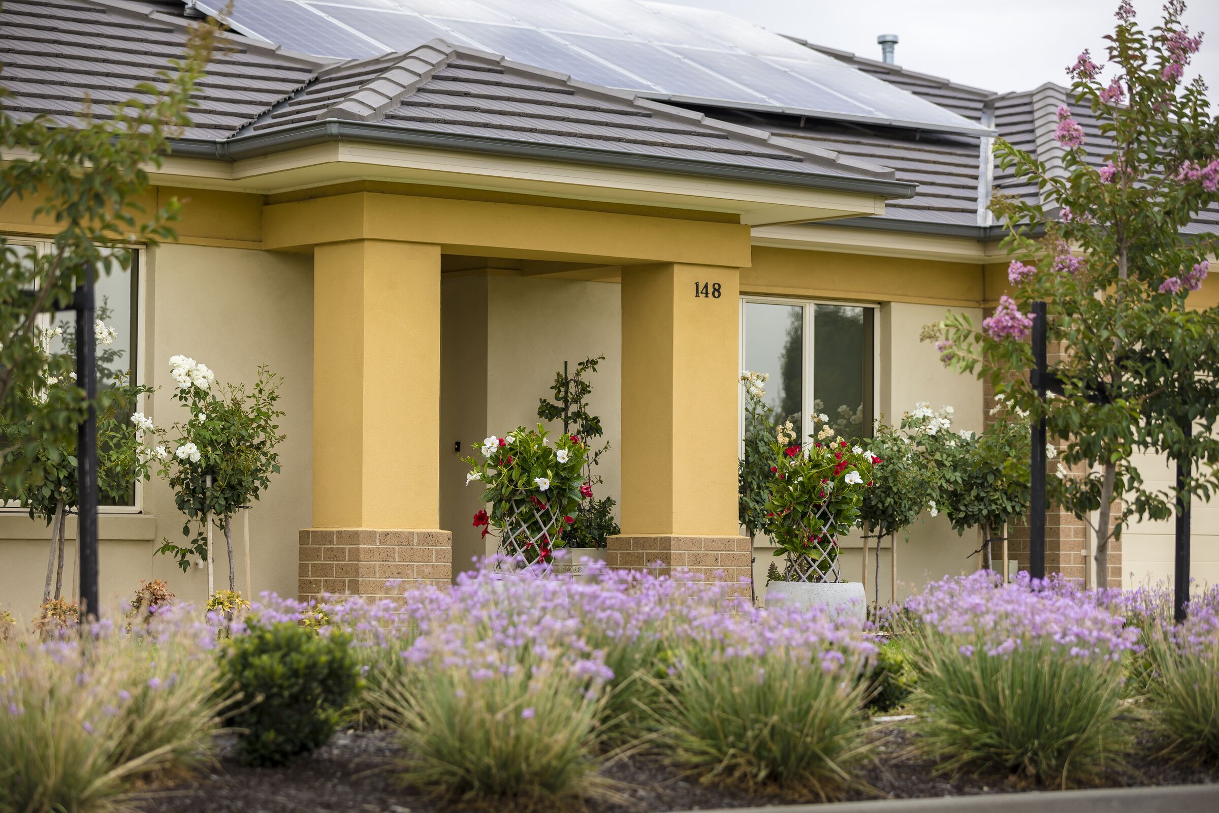 Waterford Park villa main entrance and gardens, solar panels on roof