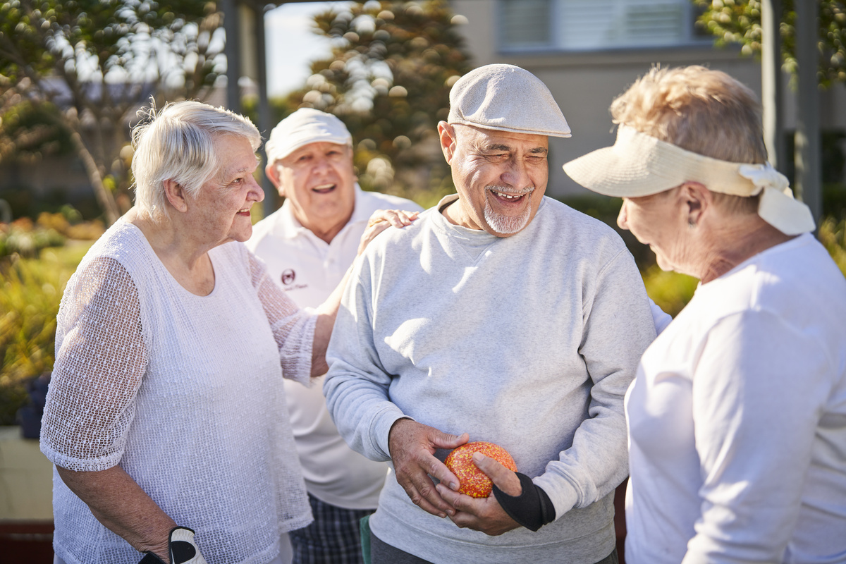 Rochford Place happy residents playing lawn bowls together