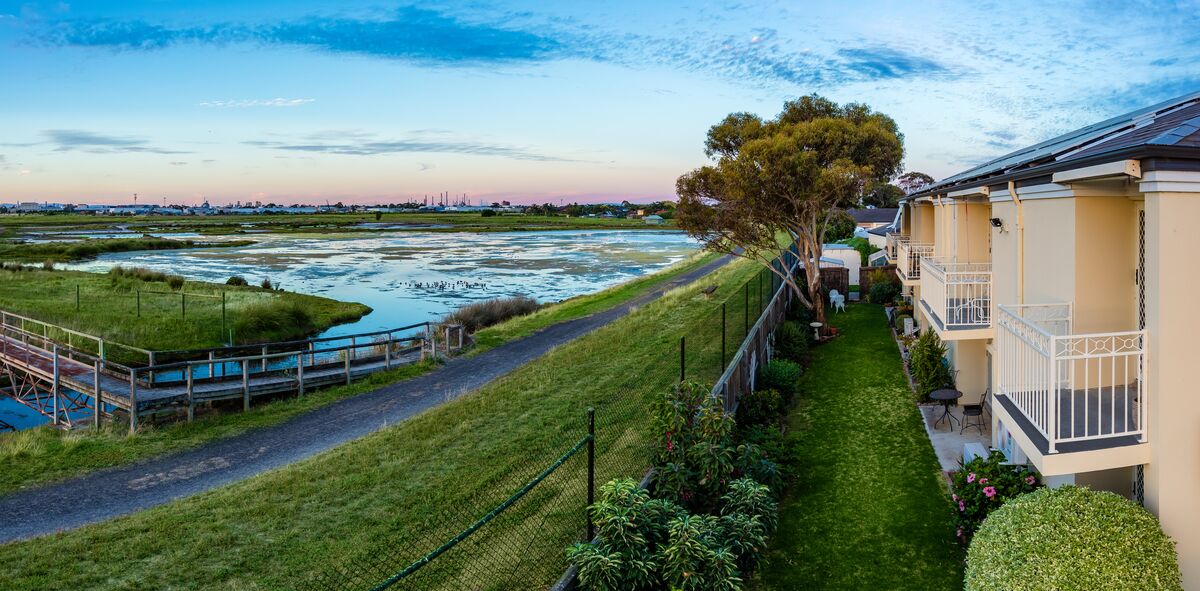 Port Phillip Village close up aerial image of main building, parking and wetlands behind