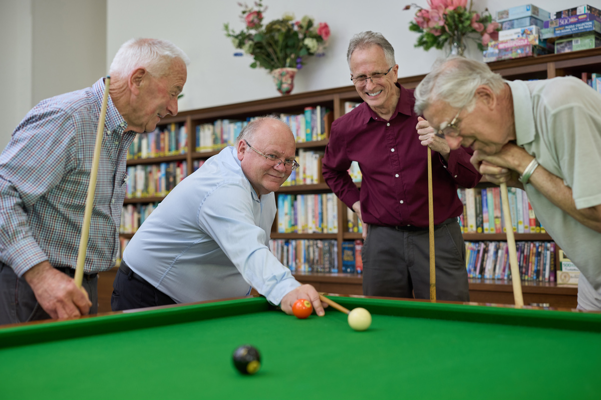 Residents playing pool