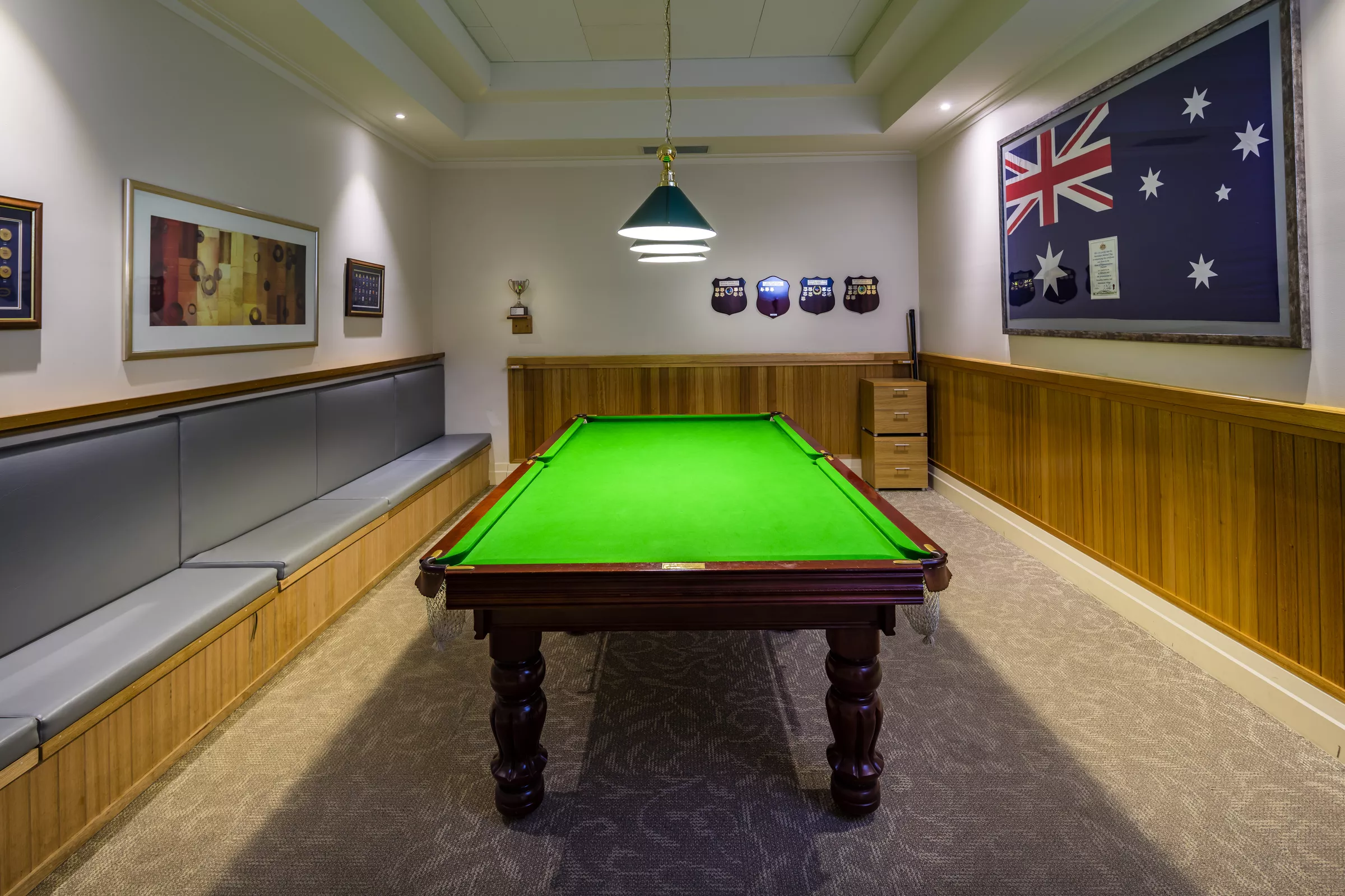 Waverley Country Club room with pool table and framed Australian flag on the wall