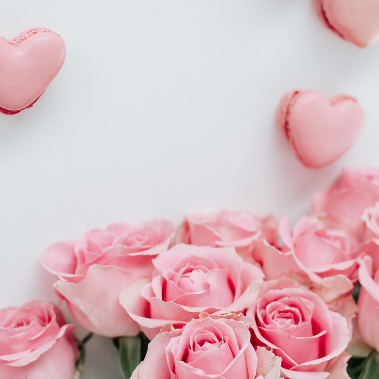 Image of pink roses and heart shaped macaroons