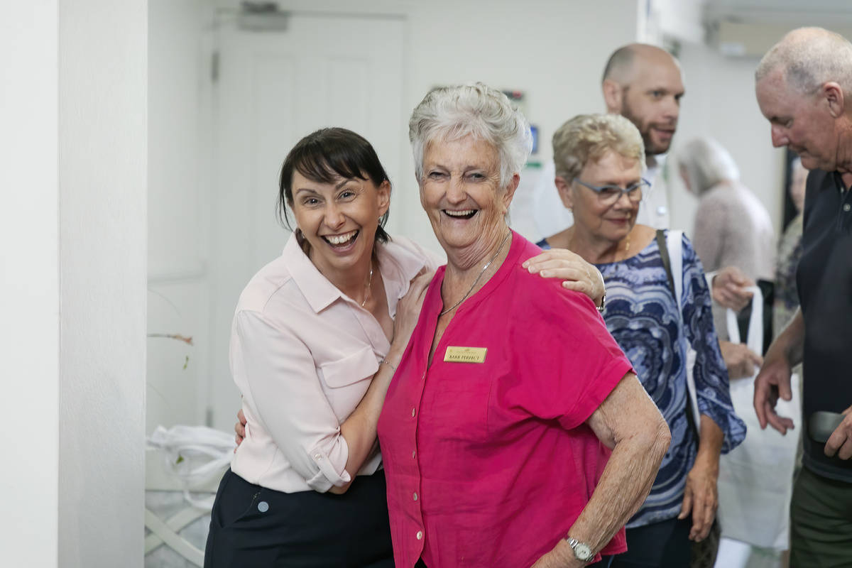 Happy staff and resident at a village