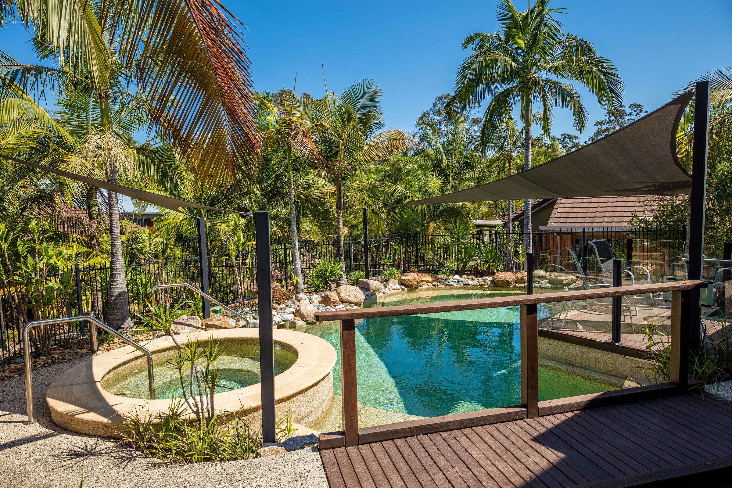 The Terraces Village outdoor pool with an amazing jacuzzi at midday
