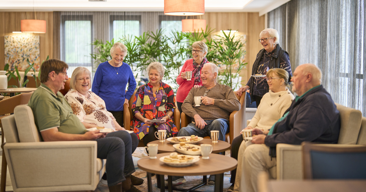 A group of residents sitting in the clubhouse and having a chat at  Kingfisher Grove, NSW