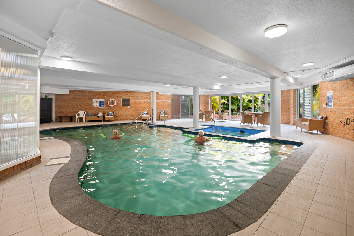Dee Why Gardens good sized indoor swimming pool with two senior residents in the water
