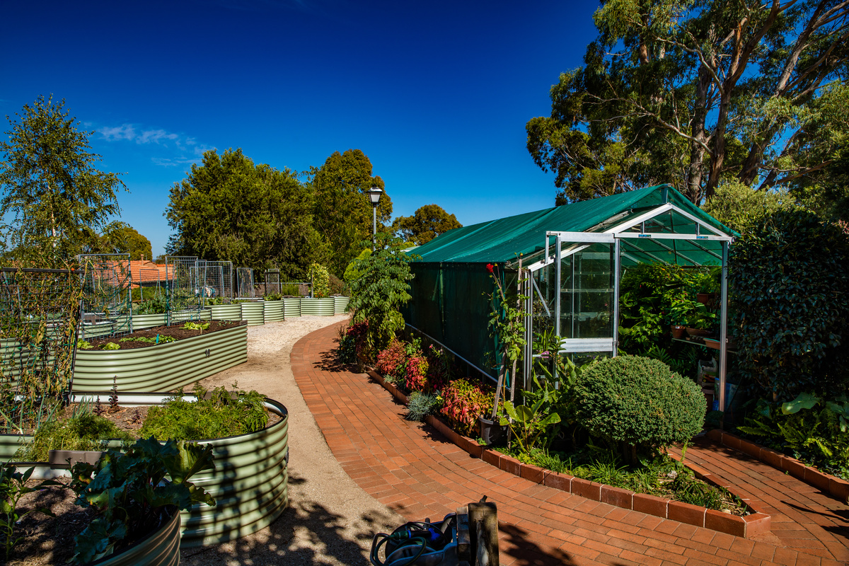 Fiddlers Green lots of raised garden beds and greenhouse