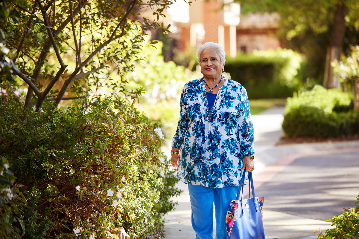 Satya walking along the village
