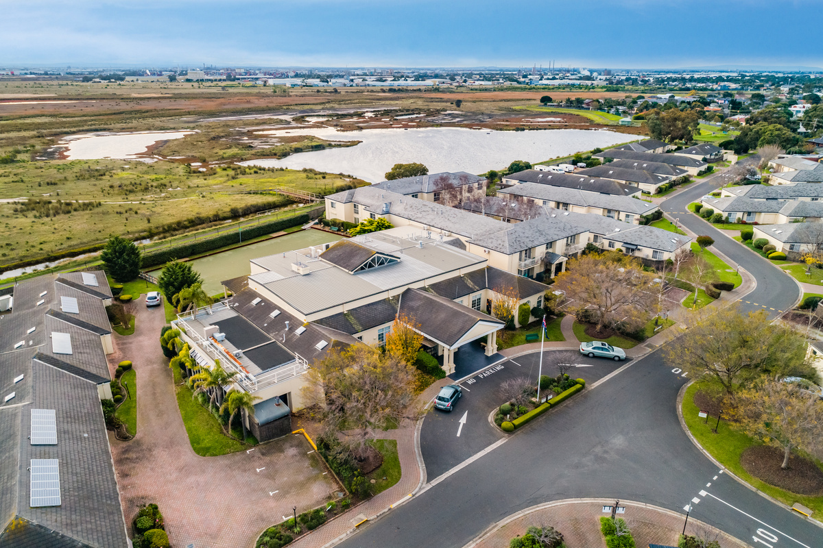 Port Phillip Village close up aerial image of main building, parking and wetlands behind