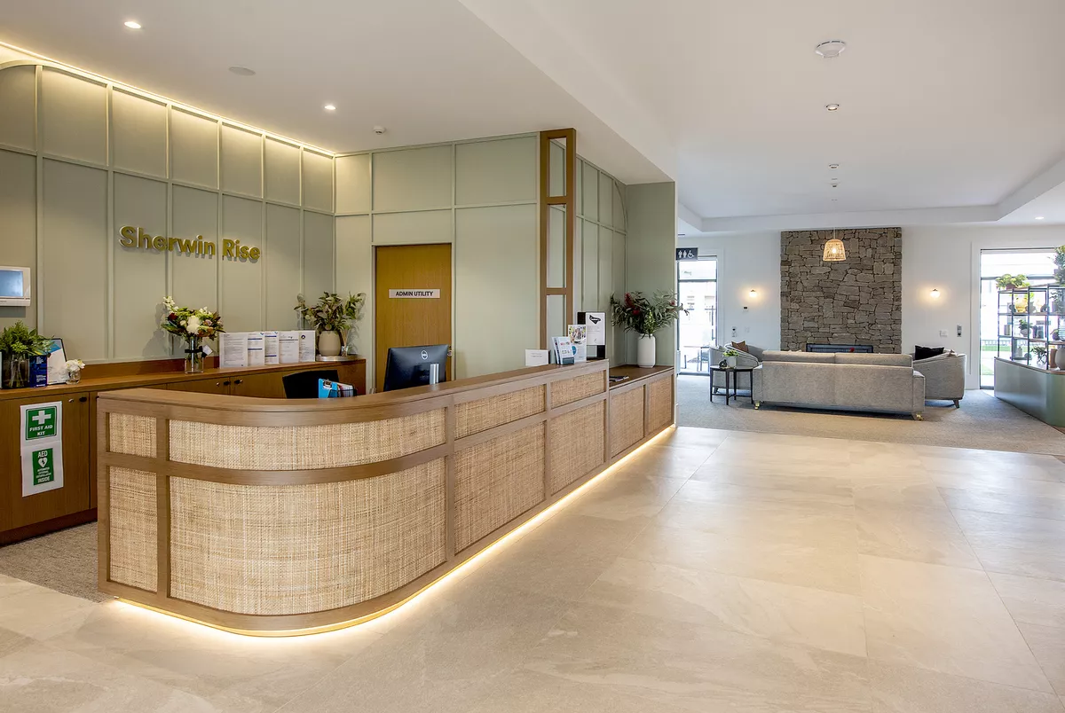 Sherwin Rise modern reception area with desk and lounge seating