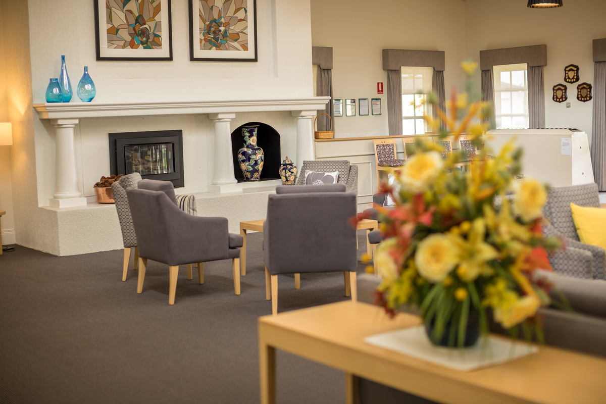 Port Phillip Village lounge area with seating and fireplace