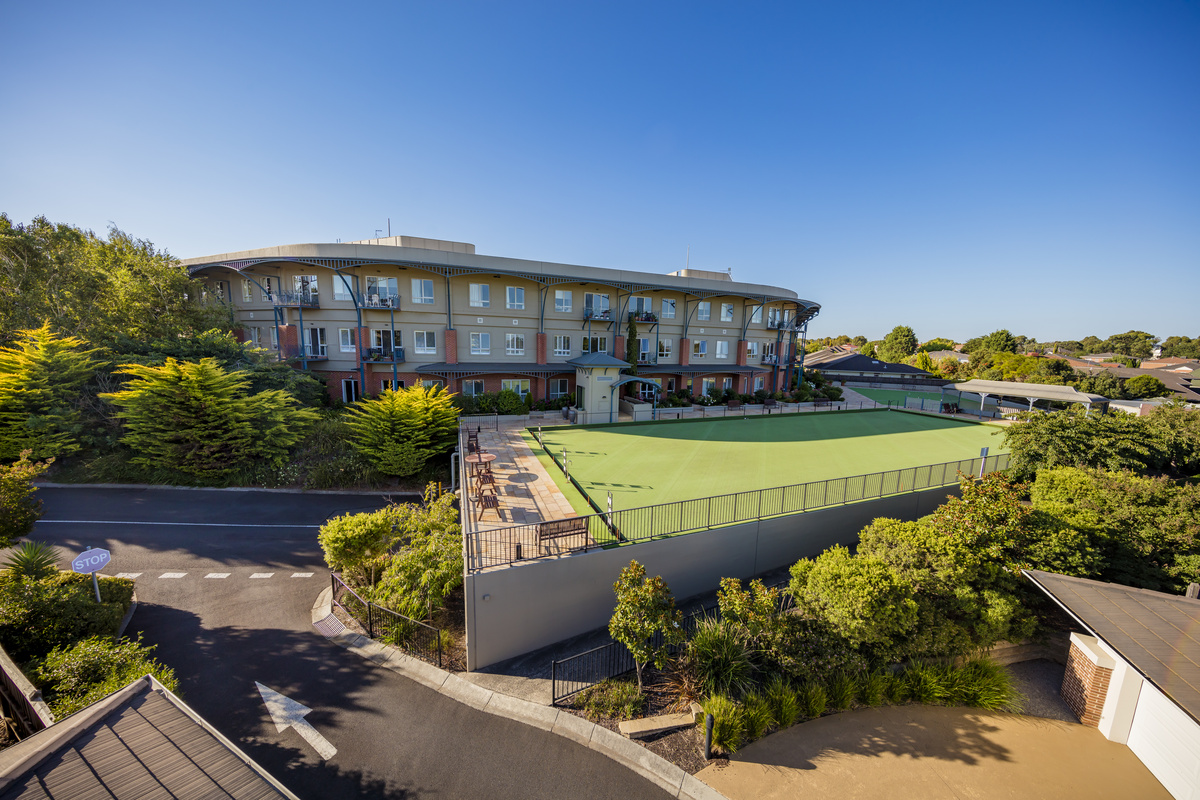 Burwood Terrace two outside bowling greens with building in the background