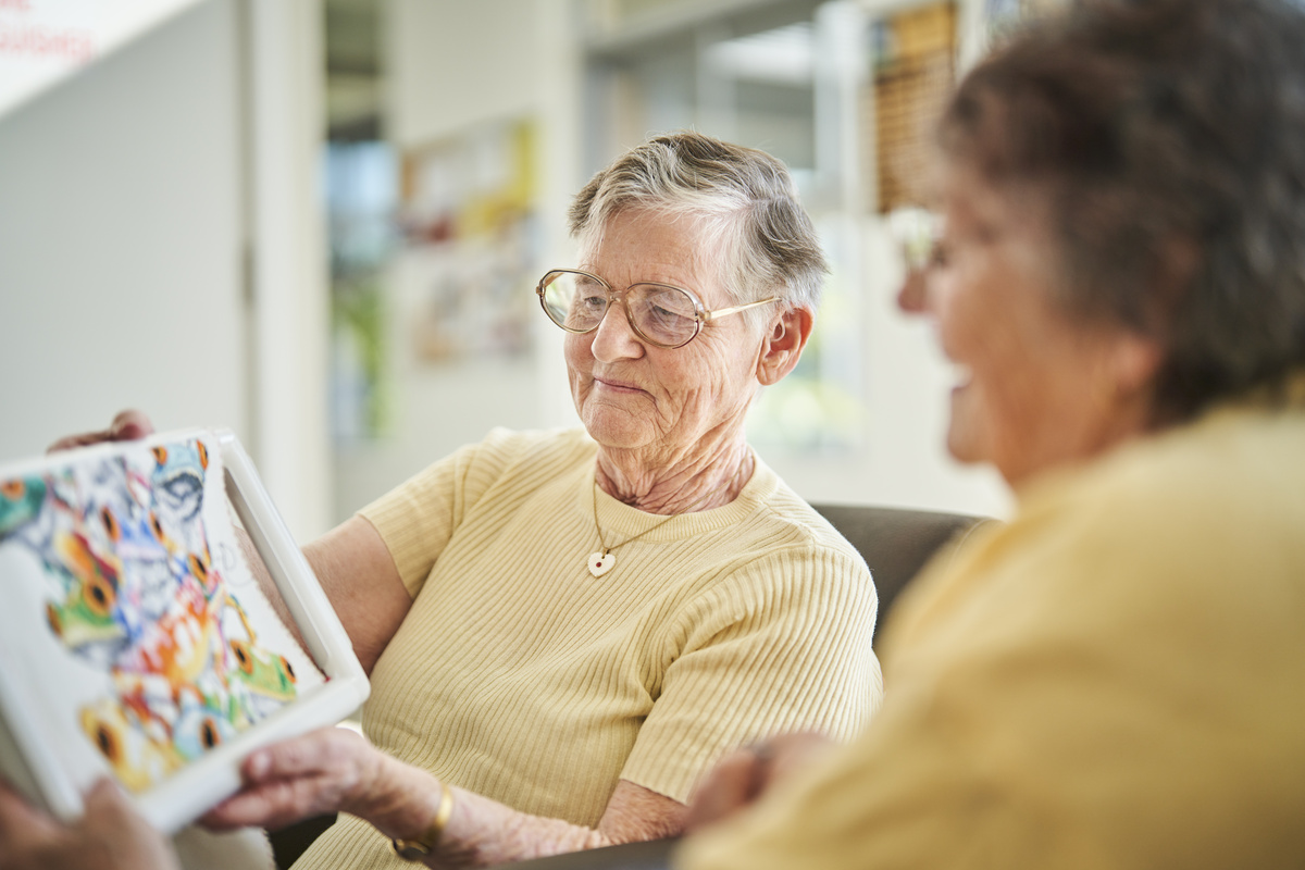 Residents showing each other artwork