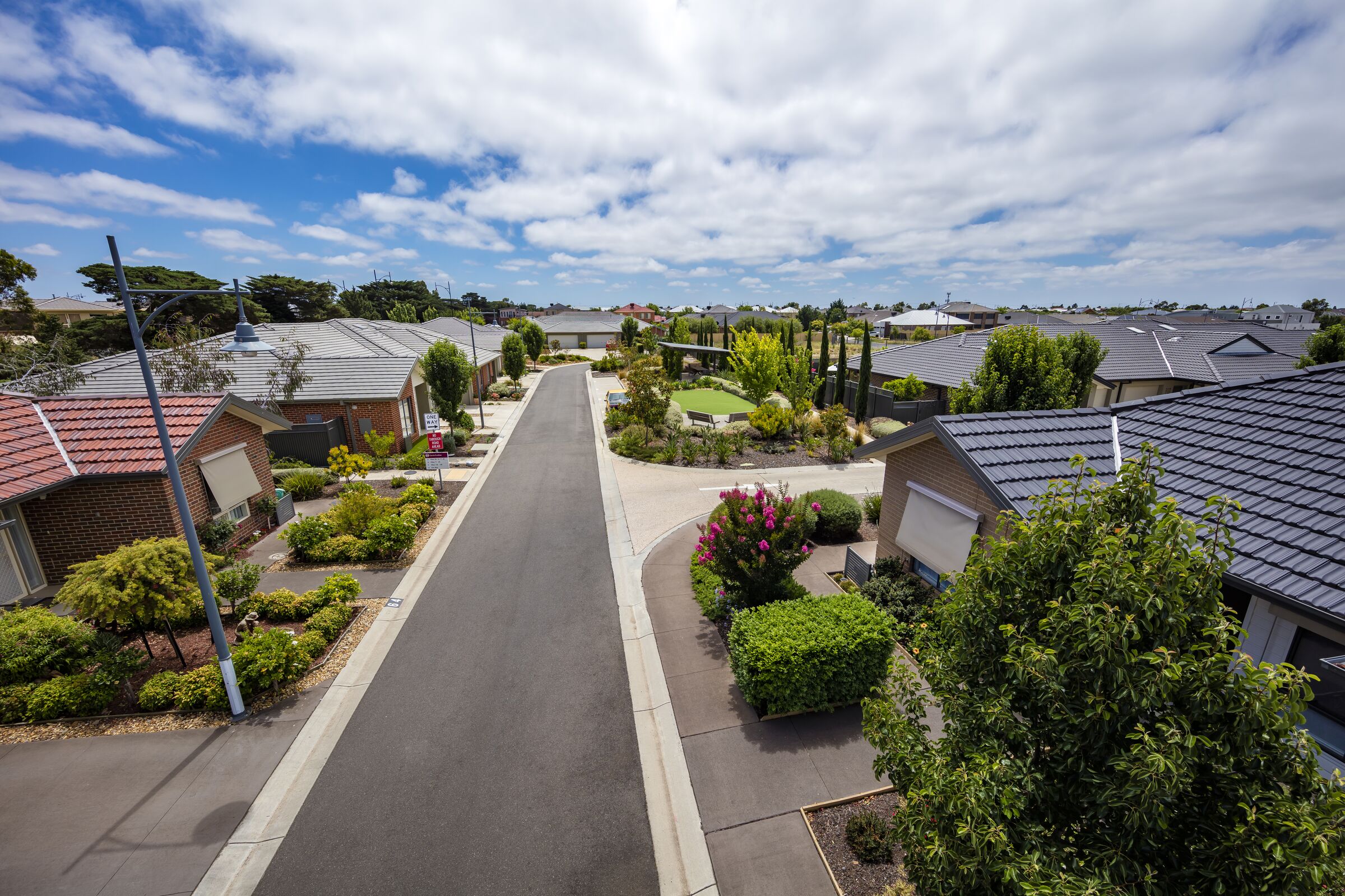 Caesia Gardens aerial image of village road and houses