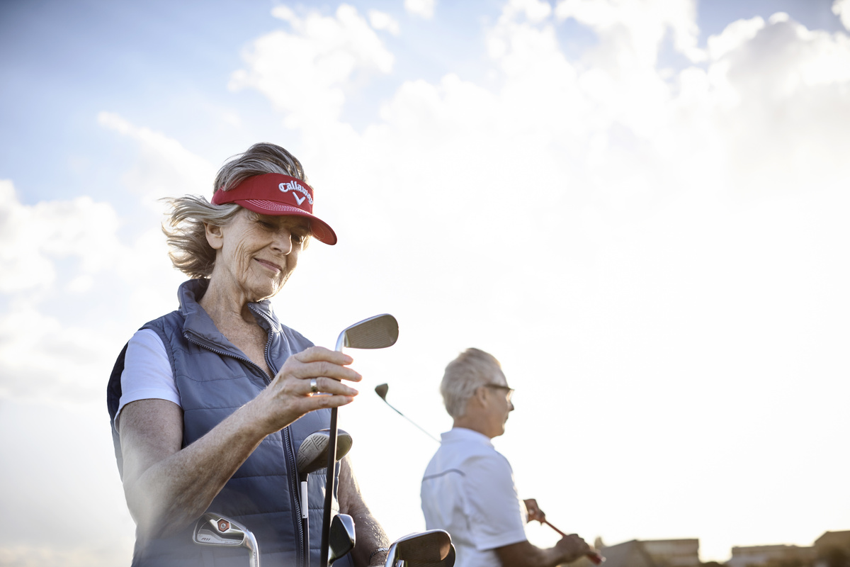Senior couple playing golf
