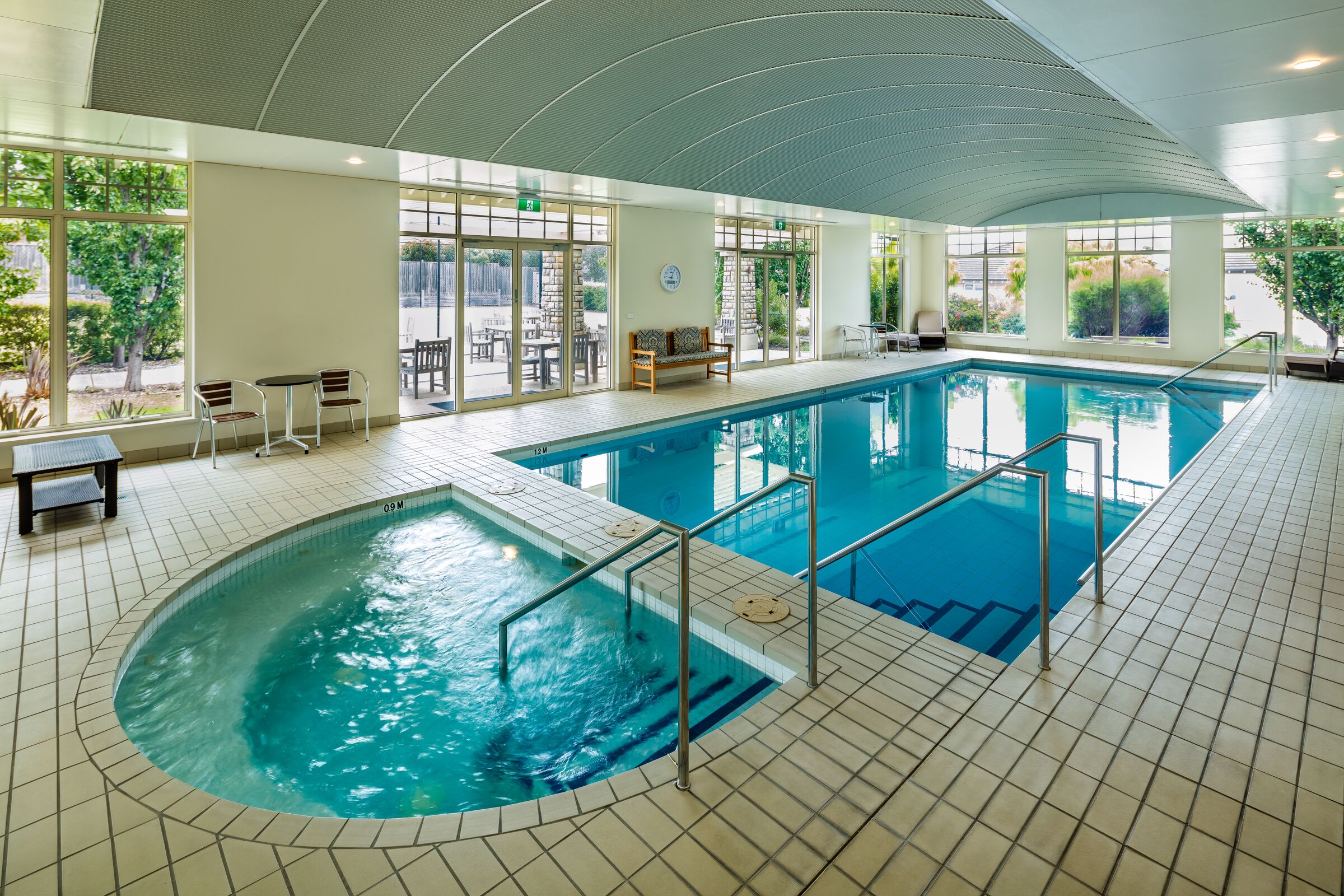 Martha's Point good sized indoor swimming pool and spa with indoor seating