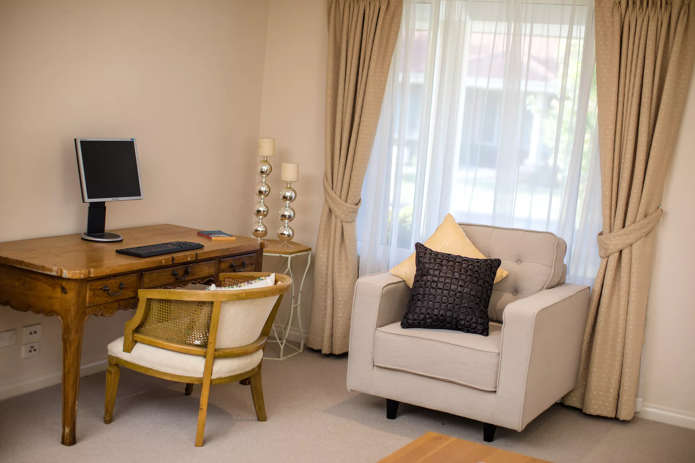 Windsor Park villa study area with desk and armchair