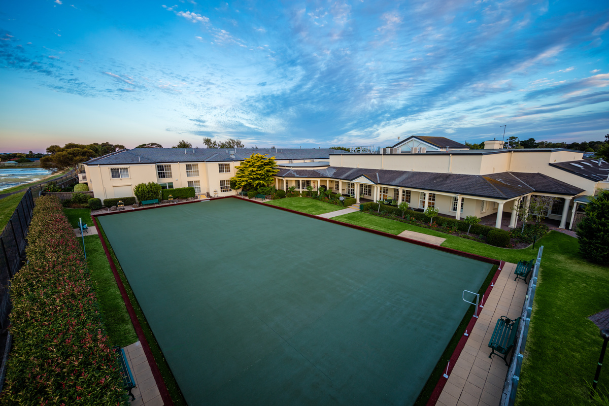 Port Phillip Village bowling green located next to main building and apartments