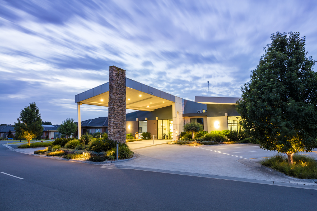 Waterford Park evening image of outside main entrance with road and carpark