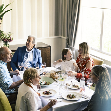 Family having lunch together sitting at the table