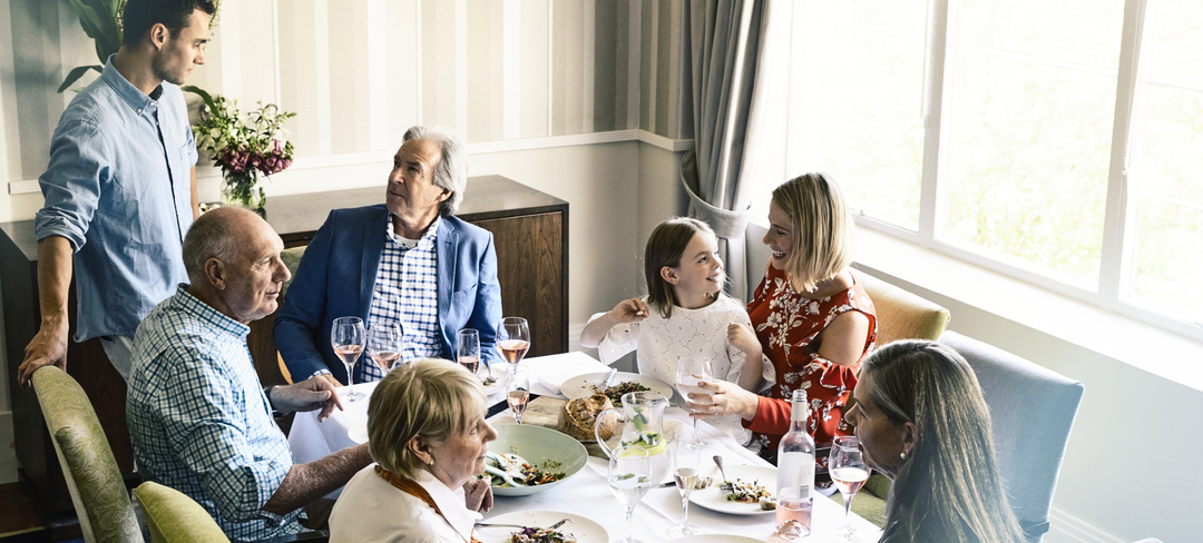 Family having lunch together sitting at the table