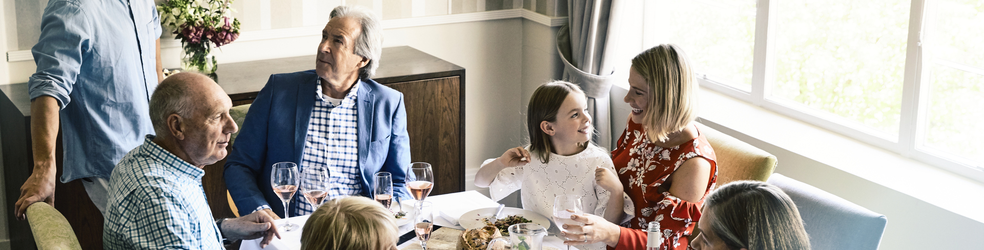 Family having lunch together sitting at the table