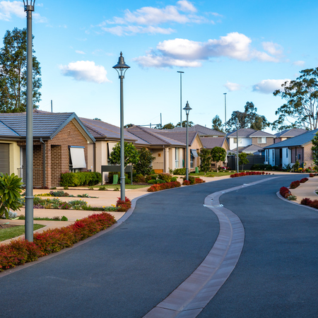 Rochford Place streetscape view of village street lined by homes with gardens