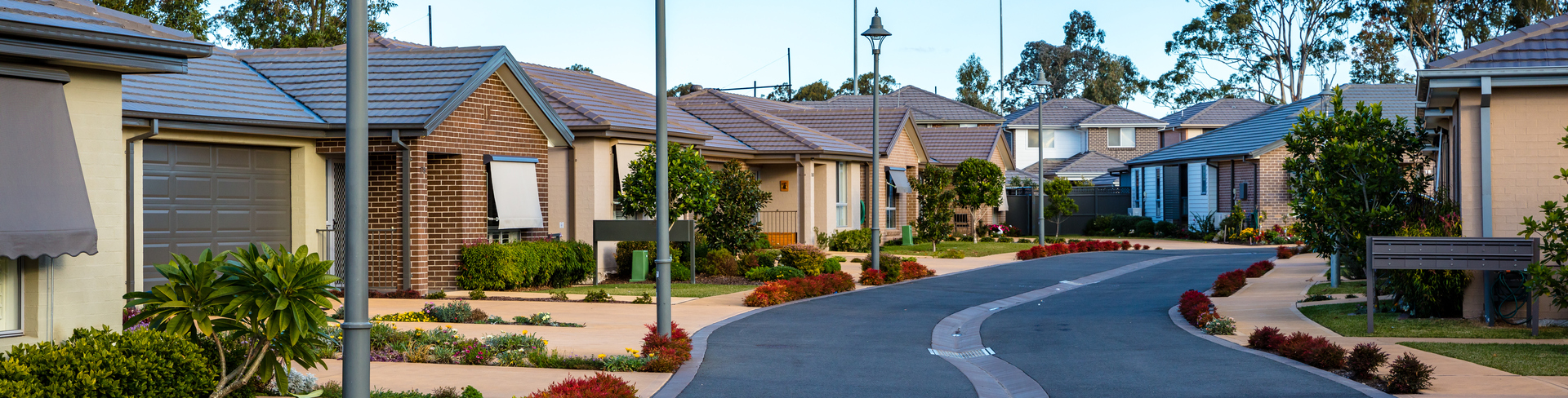 Rochford Place streetscape view of village street lined by homes with gardens