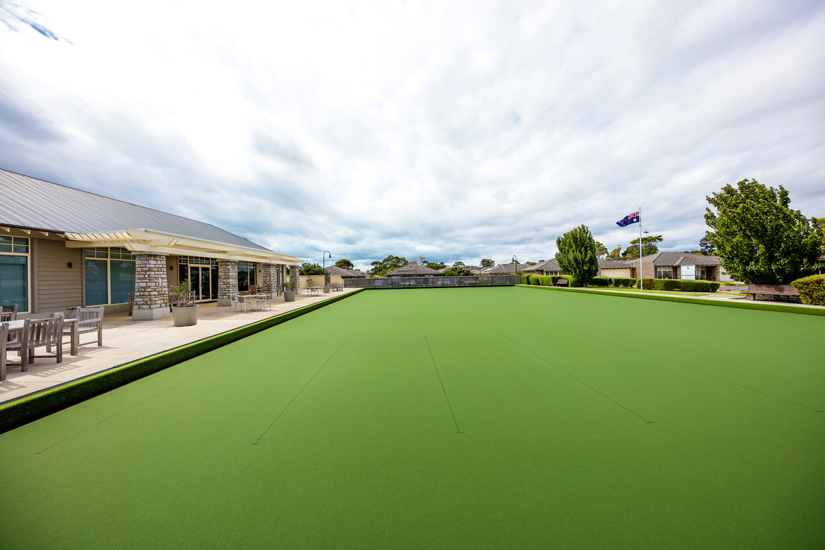 Martha's Point bowling green with seating next to main building